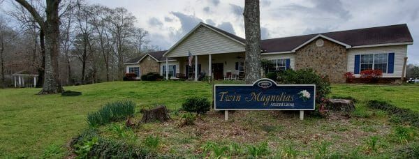 Building front and porch at Twin Magnolias Assisted Living