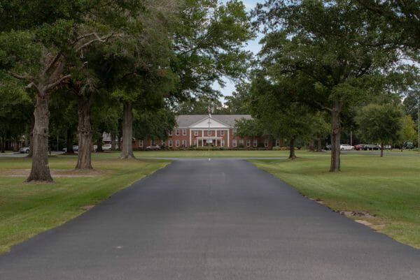 Tree lined driveway leading up to Bethea Retirement Community