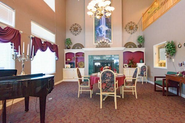 The Bridge at Colorado Springs dining room with a table in front of a fireplace
