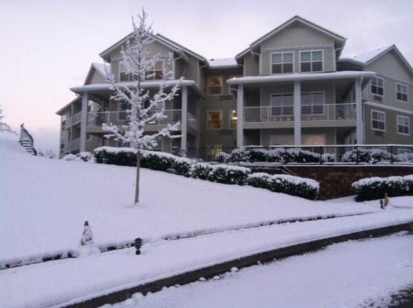 Front entrance with snow at Shasta Estates