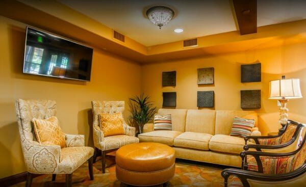 Indoor Seating Area with Flat Screen TV at The Remington Club