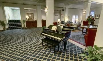 Lobby with a grand piano at Greenbriar at the Altamont