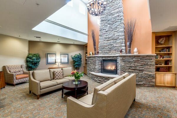 Sofas in frint of the stone fireplace at Hawthorn Court at Ahwatukee