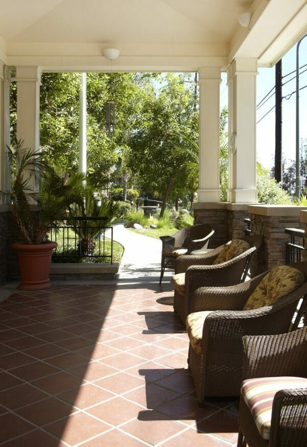 Porch with Seating Area at Sunrise of Woodland Hills
