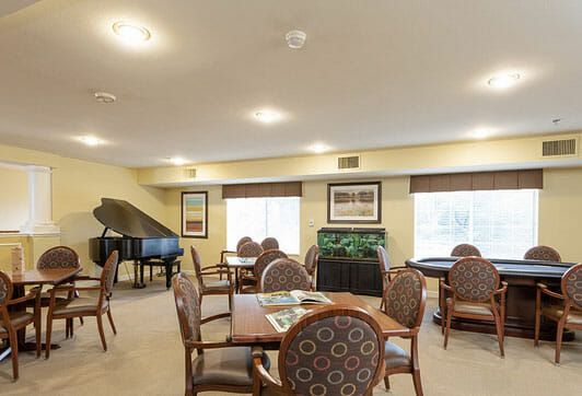 Entertainment room with grand piano in Avista Senior Living Tucson