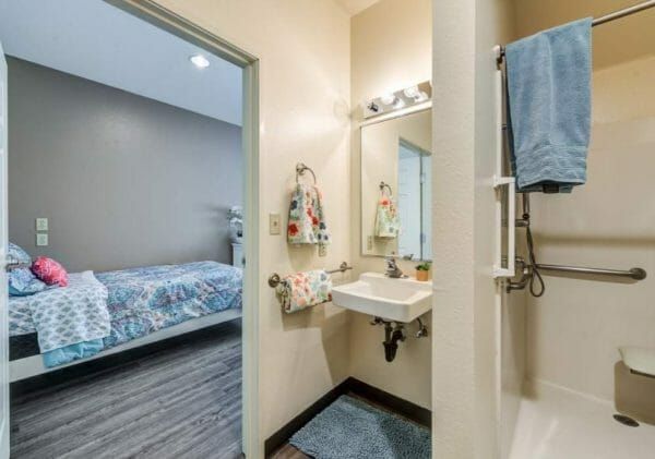 Connection Bedroom and Bathroom View in Model Apartment at Murrieta Gardens