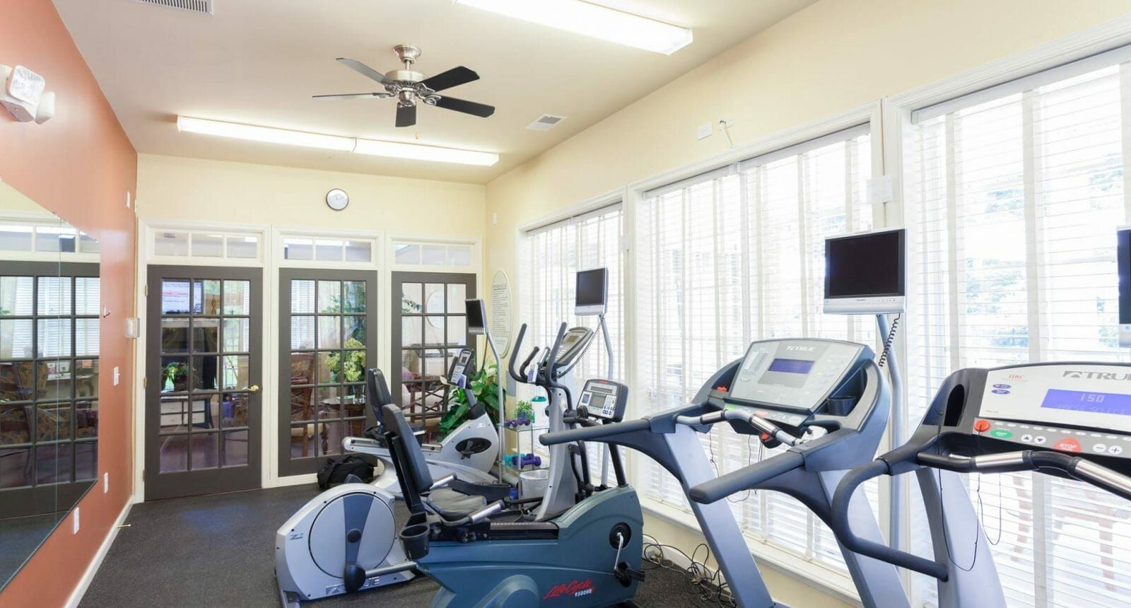 Gym room with exercise equipment at Alexander Heights