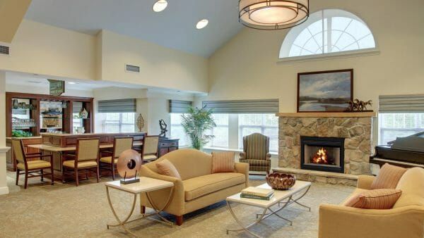 Community living room with social gathering areas in Atria Crossroads Place