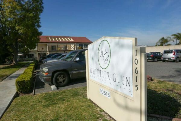 Whittier Glen Assisted Living welcome sign and building front