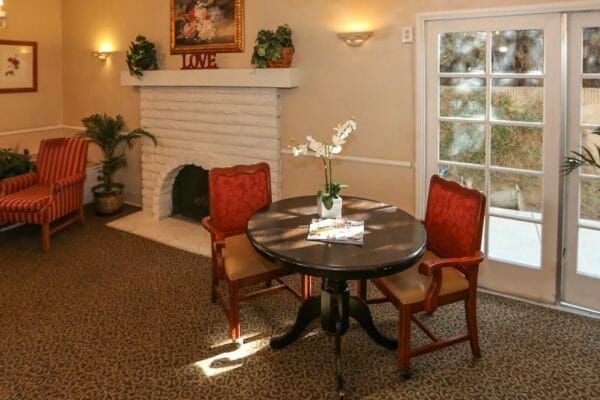 Common area and fireplace in Whittier Glen Assisted Living