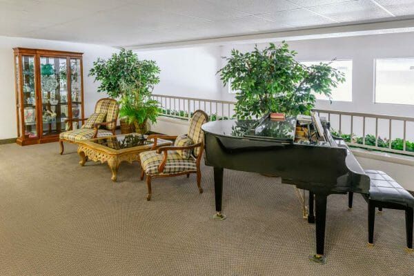 Lobby with grand piano in Eastdale Estates