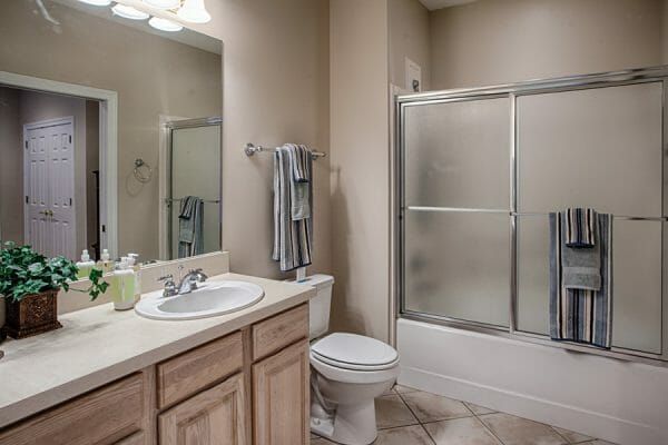 The Brennity at Fairhope independent living room with shower tub combo