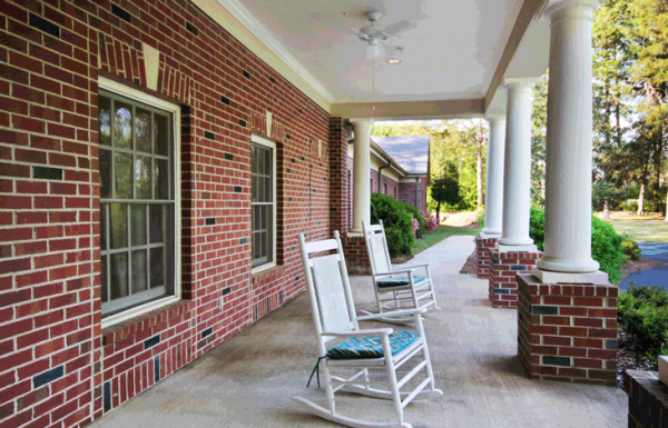 Front porch with rocking chairs at Elmcroft of Grayson Valley