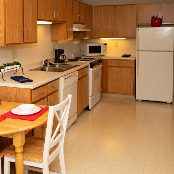 The kitchen and dining area in a model apartment at Howard Village