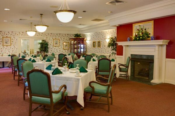 Charter Senior Living of Williamsburg community dining room and fireplace