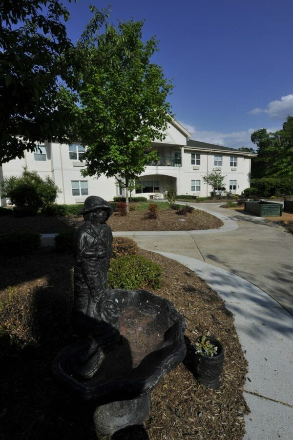 Walking paths and a water fountain on the grounds of Westchester Manor at Providence Place