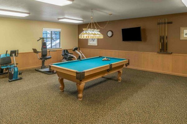 Green felt pool table in the The Springs of Napa billiards room