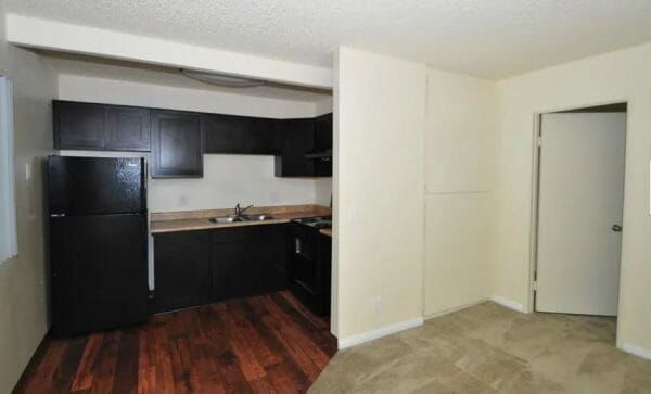 Kitchen area in unfurnished apartment at Peppertree Senior Apartments