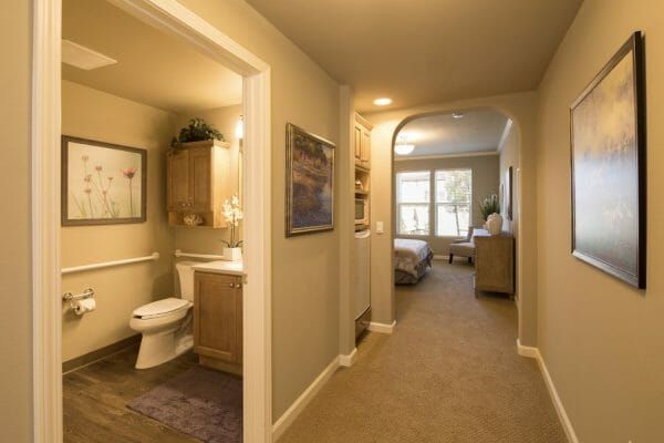 Model home with entry to bathroom and bedroom at Oakmont of Pacific Beach