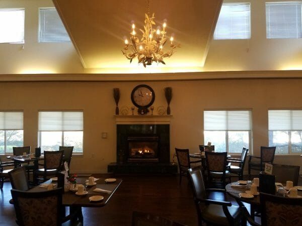 Solstice Senior Living at Fenton community dining room and fireplace