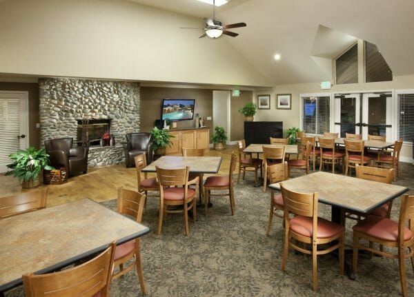 Tables and living area in the clubhouse at Vintage Oaks