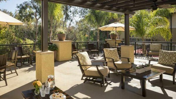 Outdoor dining tables on the Atria Del Sol covered patio