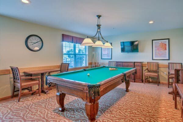 Green felt pool table in the Brookdale El Camino billiards room
