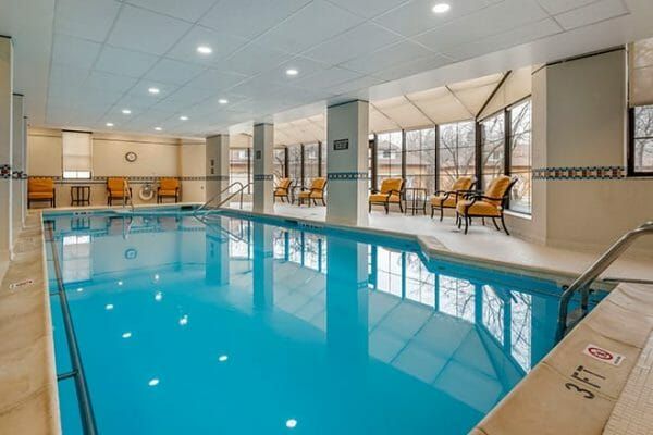 Indoor pool and resident lounge area in Brookdale Lisle