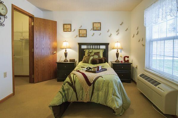 Model bedroom in a residence in Brookdale of Loveland