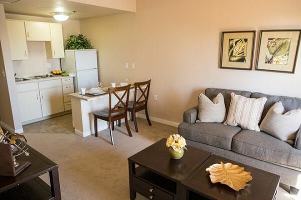 Model Apartment Living Area with Partial View of Kitchenette at Brookdale Uptown Whittier