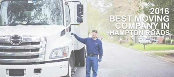 Man opening door to moving truck cab