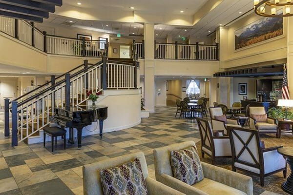 Black grand piano and resident seating in the Brookdale Meridian Westland lobby