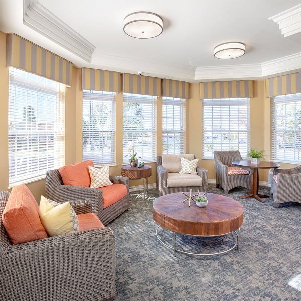 A sitting room filled with natural light at Brooklyn Pointe Assisted Living & Memory Care