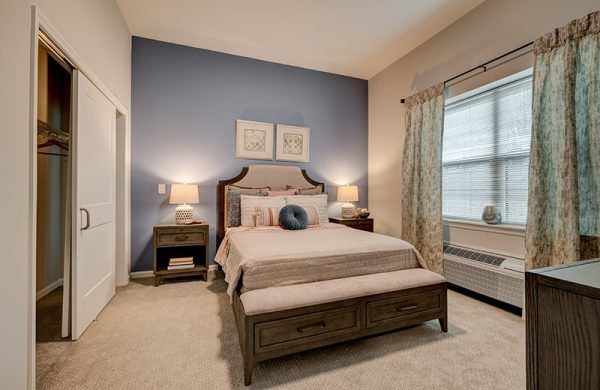 A bedroom in a model apartment at Crescent Fields at Huntingdon Valley