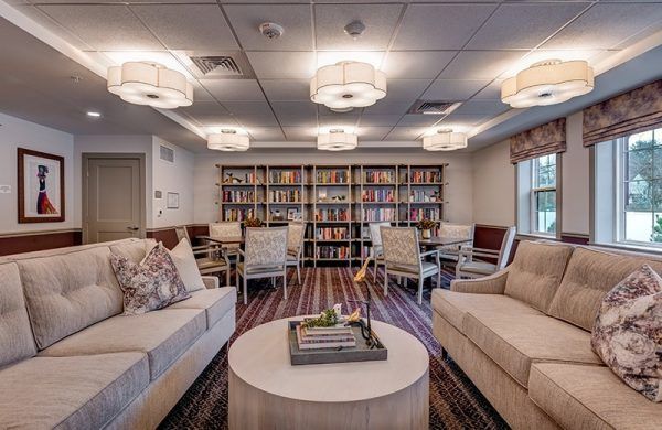 Crescent Fields at Huntingdon Valley's library, with couches and table seating