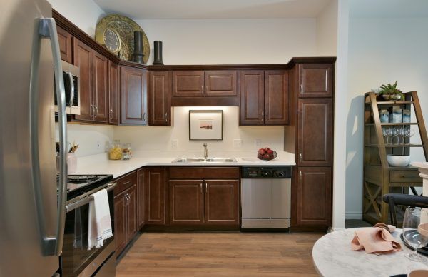An open kitchen in a model apartment at Rose Senior Living Beachwood, with stainless steel appliances