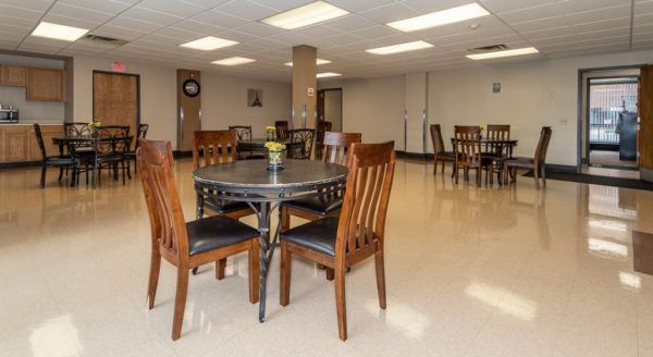 Tables and chairs in Skyline Tower Senior Apartments' community room