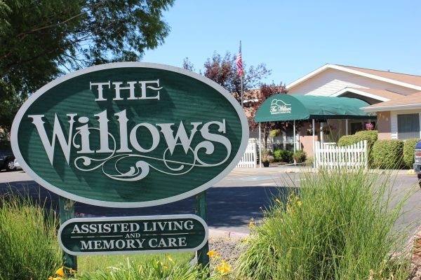 Welcome sign in front of the The Willows Assisted Living & Memory Support community entrance