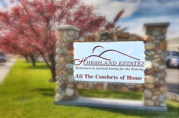 Welcome sign at the entrance to Highland Estates Assisted Living & Memory Care