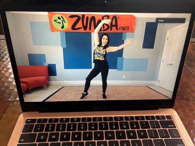 Elizabeth Moakler, a licensed Zumba Gold instructor demonstrating exercise on a laptop scren