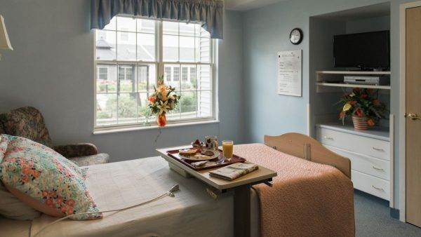 A private room at Kingston Care Center of Sylvania, with a meal on the bed tray