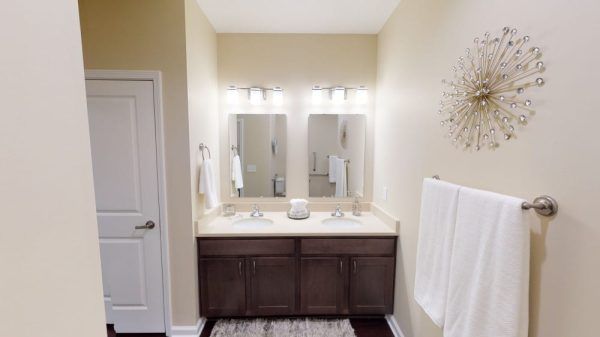 Dual vanities in the bathroom of a model villa at Traditions at North Willow