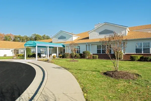Bright Leaf Place Assisted Living & Memory Care exterior of community with driveway and covered entrance