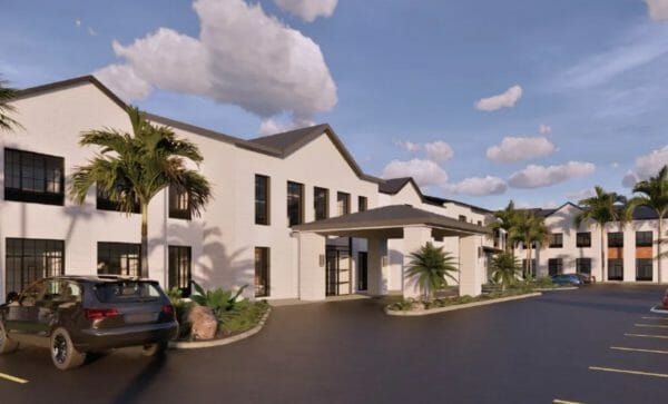 An artist rendering of Anthology of Boynton Beach's two-story building front and covered main entrance