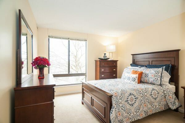 The bedroom of a model apartment at Five Star Premier Residences of Teaneck