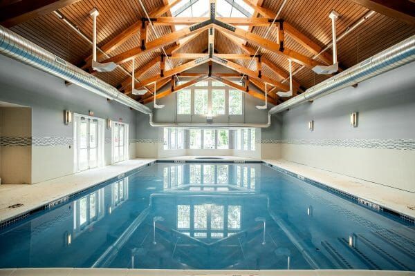 The Vista's indoor pool, under a vaulted, wood-beamed ceiling with skylights