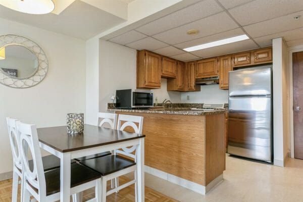 The kitchen and dining areas of Harbour View Senior Living Community's model apartment