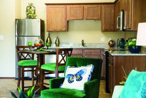 A model apartment open kitchen and dining area at Parkers Bend Retirement Community