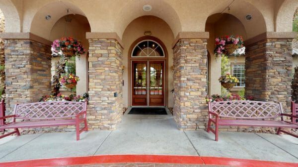 Carefree Senior Living at The Willows' front doors and outdoor benches