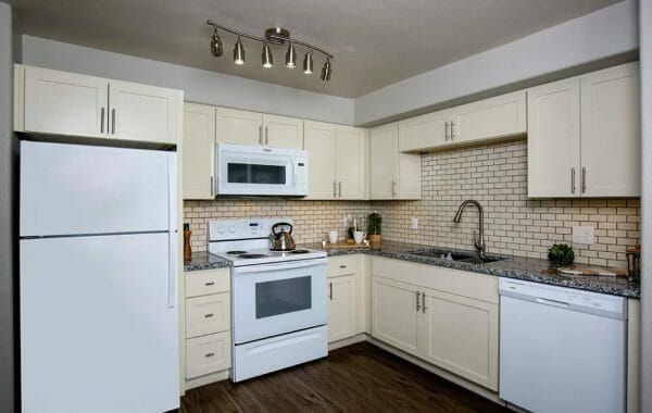 Court Senior Apartments' model apartment kitchen, with white appliances